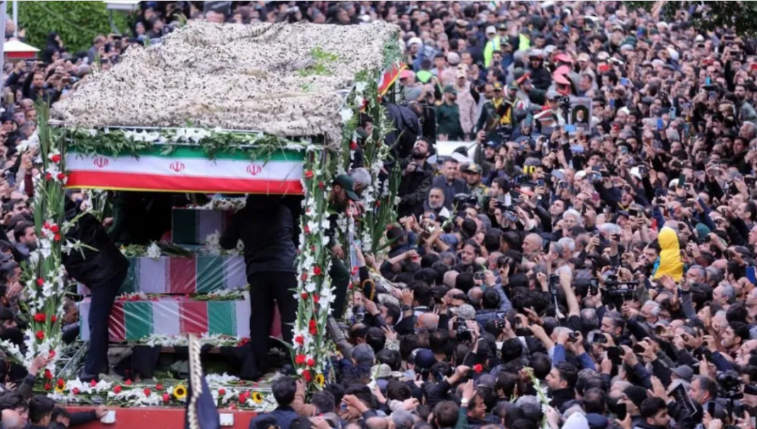 Thousands attend Iran president's funeral procession