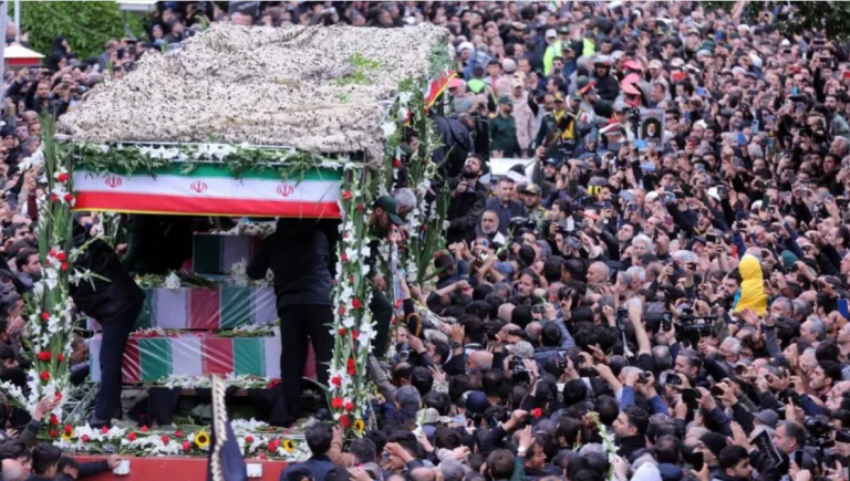 Thousands attend Iran president’s funeral procession